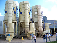 New dryers alongside storage barns at the peanut plant.